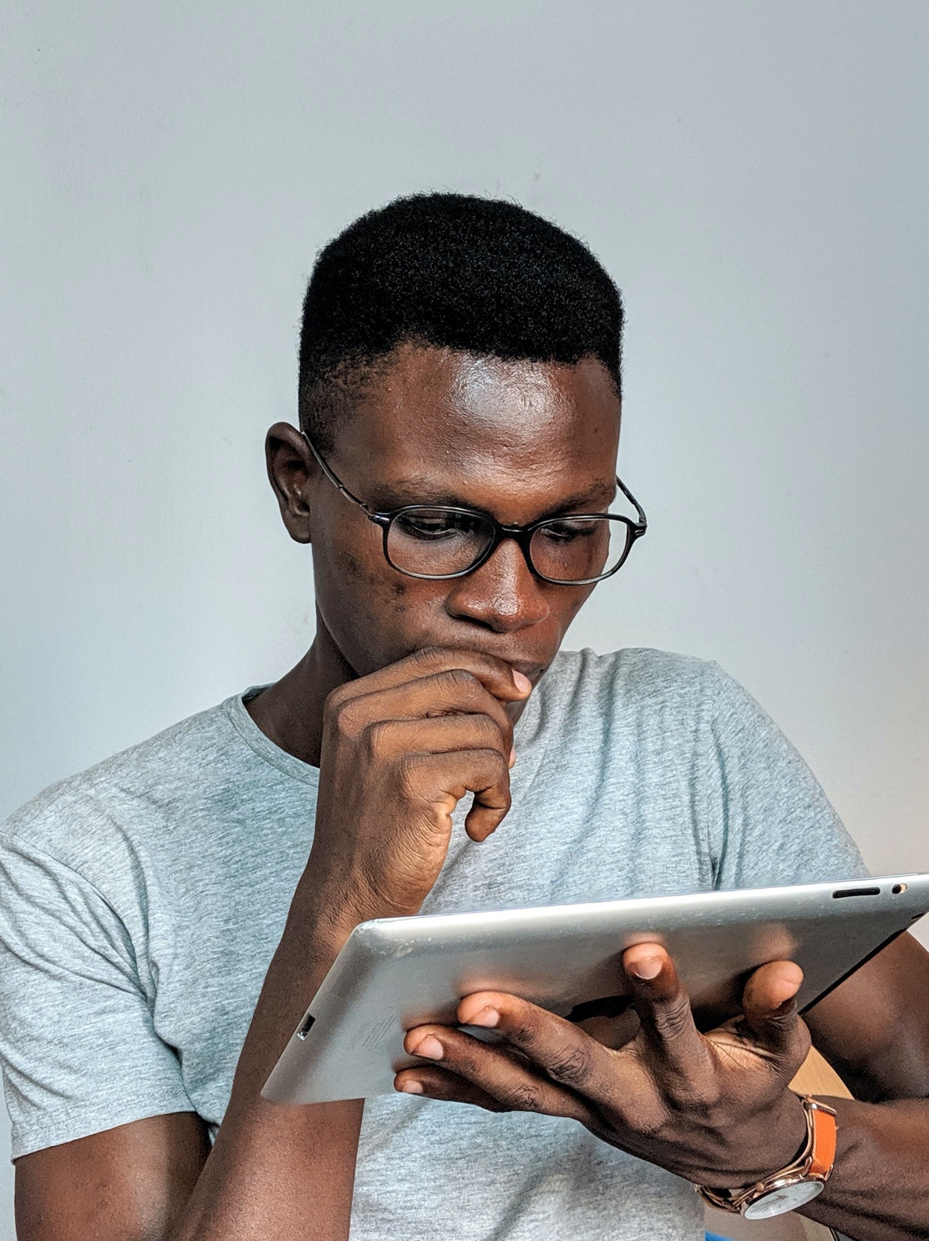 A man reading a tablet